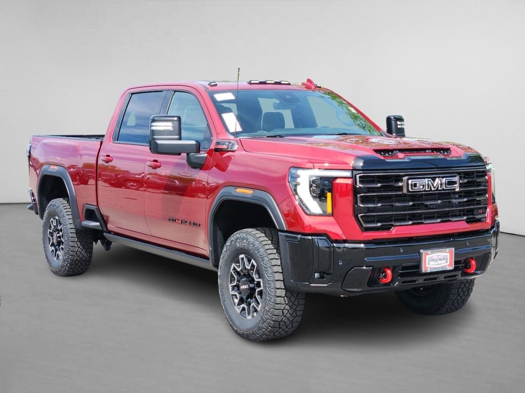 2026 GMC Sierra 2500 HD AT4X in Volcanic Red Tintcoat — front three-quarter view