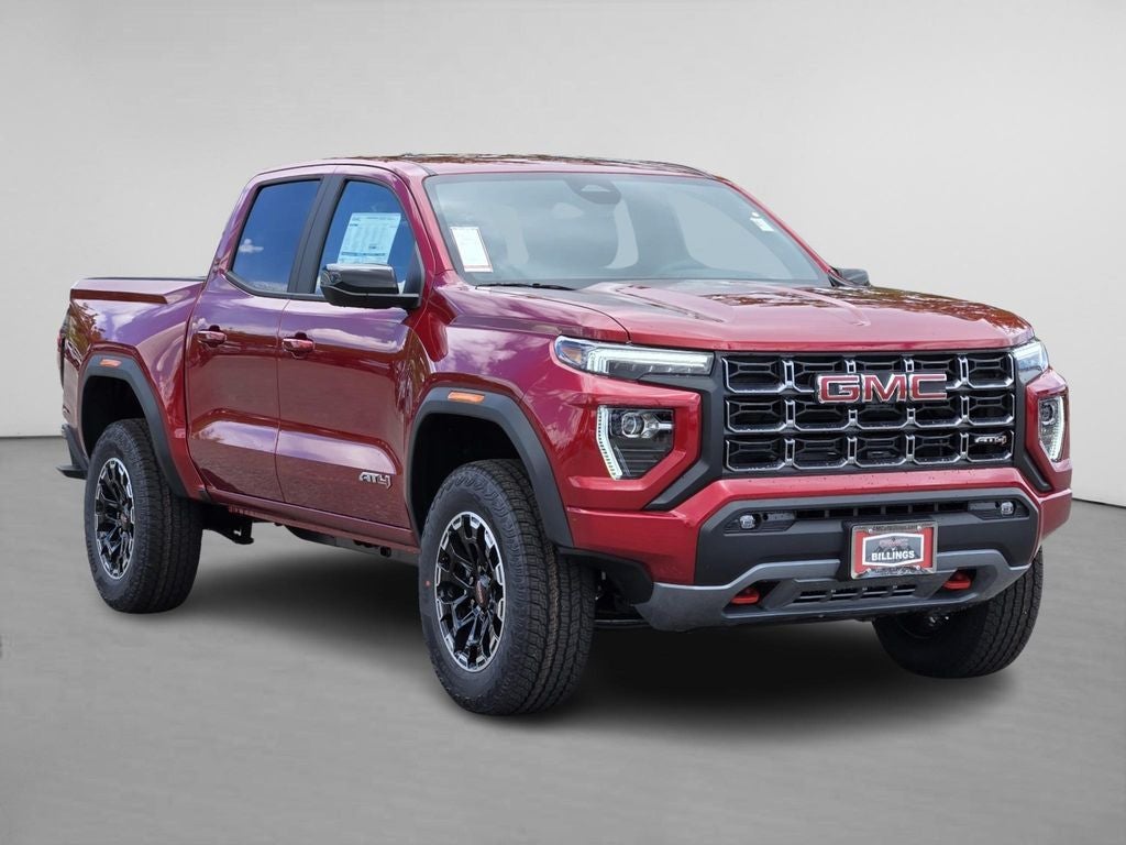 2026 GMC Canyon AT4 in Volcanic Red Tintcoat — front three-quarter view